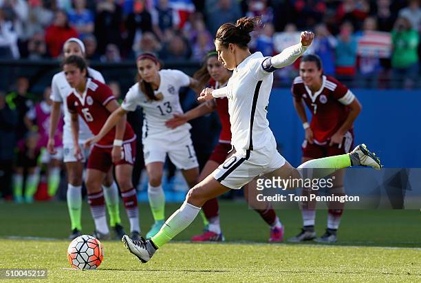 Carli Lloyd of USA kicks a penality kick ans scores against Cecilia Santiago of Mexico in the second half during the United States v Mexico: Group A...