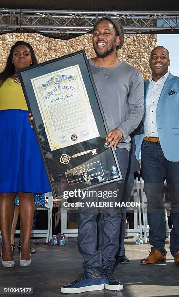 Rapper Kendrick Lamar attends the ceremony honoring him with the Keys of the City of Compton, in Compton, California, on February 13, 2016. / AFP /...