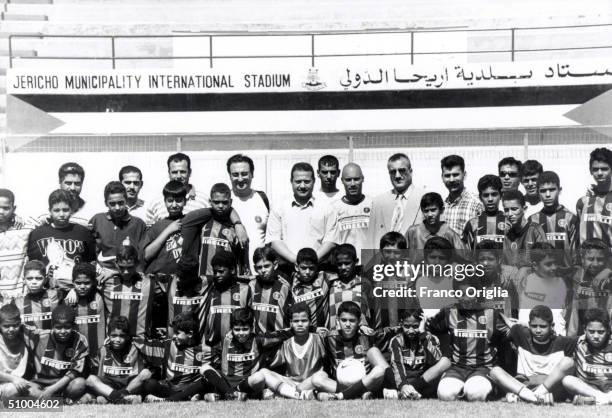 Young footballers involved with Inter Campus Project pose for a photo at the Jericho Stadium May 12, 2000 in Jericho, Palestine. Inter Campus is a...