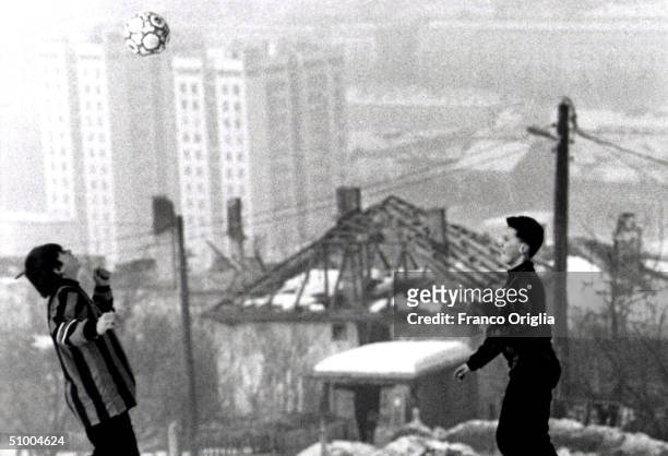 Young footballers involved with Inter Campus Project juggle a ball, February 5, 2001 in Sarajevo, Bosnia and Herzegovina. Inter Campus is a social...