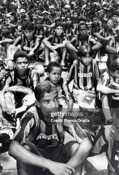 Young footballers involved with Inter Campus Project sit during a meeting at the Recife Zoo April 26, 1999 in Recife, Brazil. Inter Campus is a...