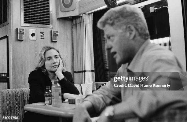 On a campaign bus on their way from Portland to Seattle, American President Bill Clinton speaks with Washington state gubernatorial candidate Gary...