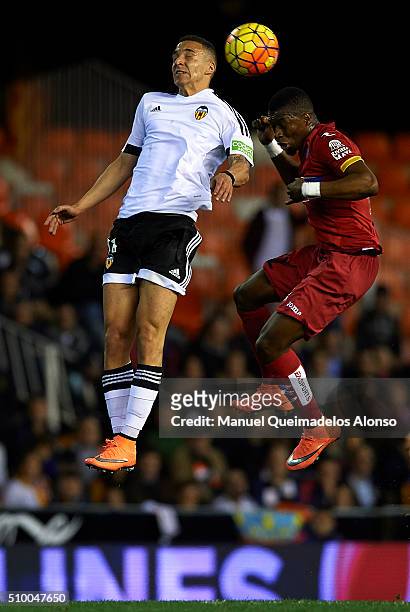 Rodrigo Moreno of Valencia competes for the ball with Papakouly Diop of Espanyol during the La Liga match between Valencia CF and RCD Espanyol at...