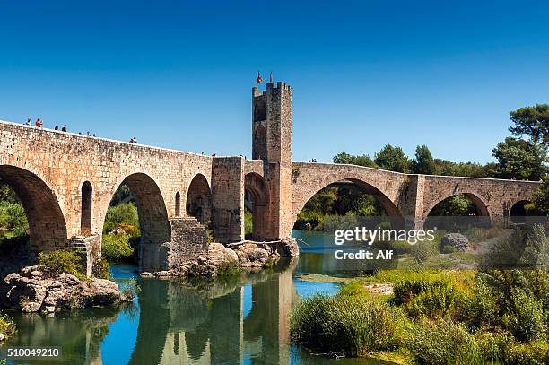 girona - besalu (medieval bridge) - besalu stock pictures, royalty-free photos & images