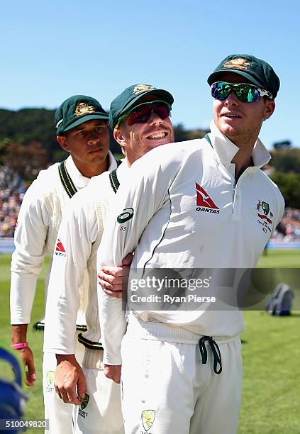 Usman Khawaja, David Warner and Steve Smith of Australia prepare to take to the field during day three of the Test match between New Zealand and...