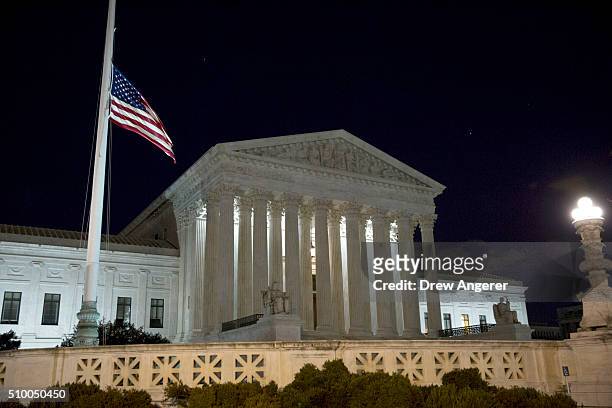 The American flag flies at half mast at the U.S. Supreme Court February 13, 2016 in Washington, DC. Supreme Court Justice Antonin Scalia was at a...