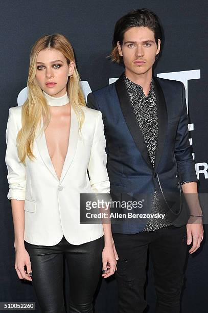 Actress Nicola Peltz and actor Israel Broussard attend SAINT LAURENT At The Palladium at Hollywood Palladium on February 10, 2016 in Los Angeles,...
