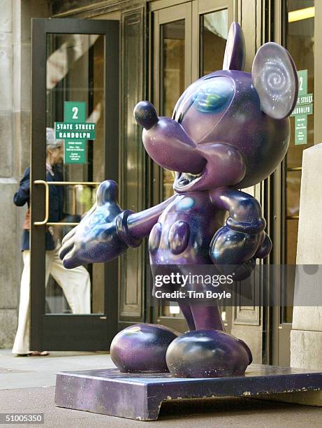 Mickey Mouse statue titled "Space Mouse," designed by Tom Hanks, stands along State Street June 28, 2004 in Chicago, Illinois. This is one of several...