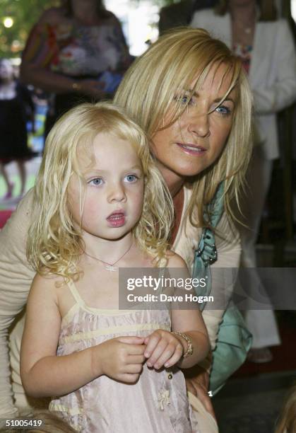 Meg Matthews and daughter Anais arrive at the UK Charity Premiere of "Shrek 2" at the Empire Leicester Square on June 28, 2004 in London. The...