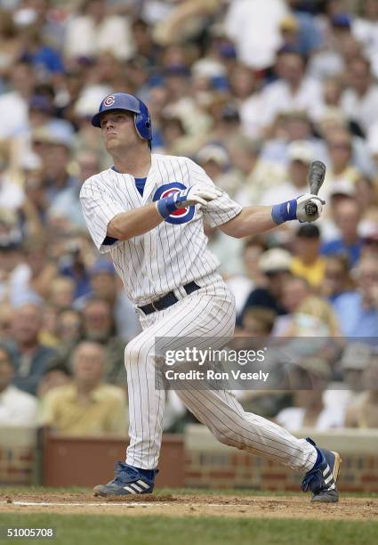 Michael Barrett of the Chicago Cubs bats during the game against the St. Louis Cardinals at Wrigley Field on June 9, 2004 in Chicago, Illinois. The...