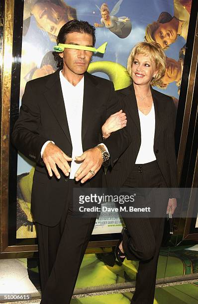 Actor Antonio Banderas with actress wife Melanie Griffith arrive at the UK Charity Premiere of 'Shrek 2' at the Empire Leicester Square on June 28,...