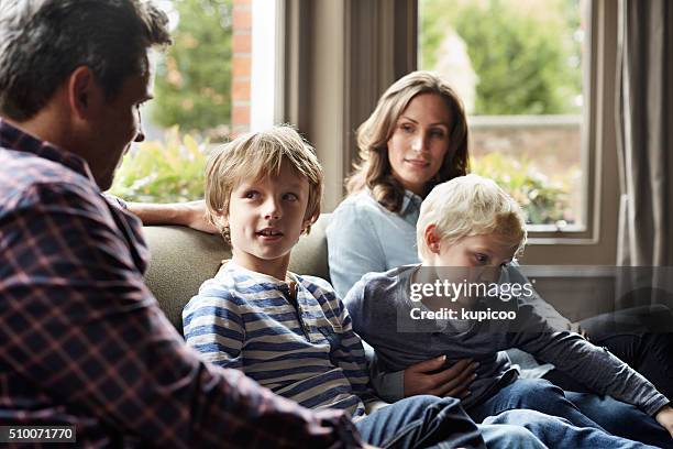 enjoying some family time - family talking stock pictures, royalty-free photos & images