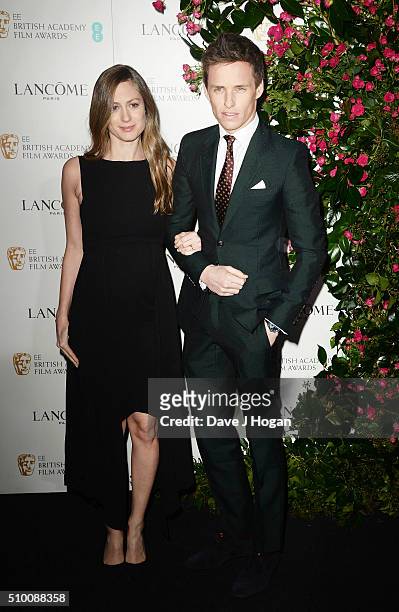 Eddie Redmayne and Hannah Bagshawe attend the Lancome BAFTA nominees party at Kensington Palace on February 13, 2016 in London, England.