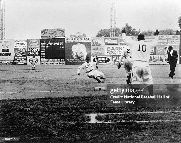 James "Cool Papa" Bell of the Homestead Grays slides to avoid the tag during a Negro League game in Washington D.C. Cool Papa played for the Grays in...