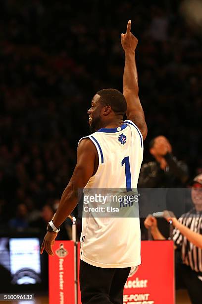 Actor Kevin Hart reacts after making a basket in a three point contest against Draymond Green of the Golden State Warriors before the Foot Locker...