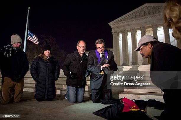 Group of people pray in front of the U.S. Supreme Court February 13, 2016 in Washington, DC. Supreme Court Justice Antonin Scalia was at a Texas...