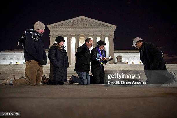 Group of people pray in front of the U.S. Supreme Court February 13, 2016 in Washington, DC. Supreme Court Justice Antonin Scalia was at a Texas...