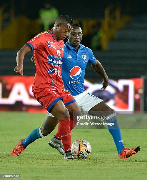 Deiver Machado of Millonarios fights for the ball with Brayan Angulo of Deportivo Pasto during the match between Millonarios and Deportivo Pasto as...