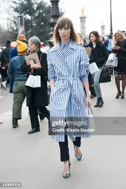 Fashion director and stylist Anya Ziourova wears a Celine coat and Pierre Hardy shoes on day 3 of Paris Haute Couture Fashion Week Spring/Summer...