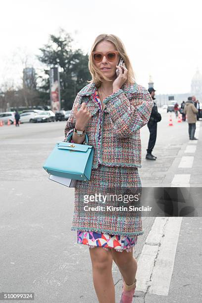 Russian Journalist for L'Officiel Ksenia Sobchak wears a Chanel suit and boots and a Hermes bag on day 3 of Paris Haute Couture Fashion Week...
