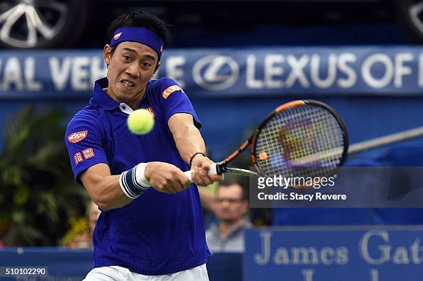 Kei Nishikori of Japan returns a shot to Sam Querrey of the United States during their semi-final singles match on Day 6 of the Memphis Open at the...