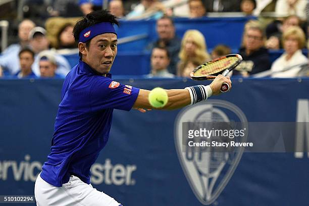 Kei Nishikori of Japan returns a shot to Sam Querrey of the United States during their semi-final singles match on Day 6 of the Memphis Open at the...
