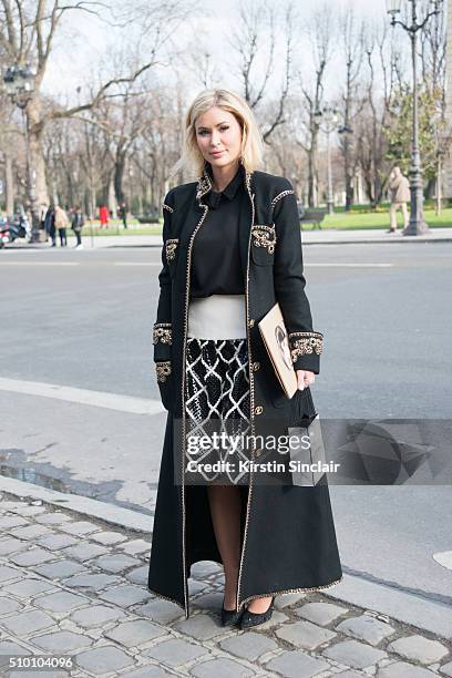Fashion designer Ash Tailor wears a Ted Baker top, Chanel skirt and Chanel coat on day 3 of Paris Haute Couture Fashion Week Spring/Summer 2016, on...