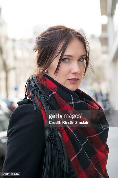 Artist and model Anastasia Shchipanova wears a Zadig and Voltaire scarf, and Burberry coat on day 3 of Paris Haute Couture Fashion Week Spring/Summer...