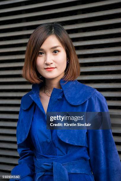 Fashion blogger Miu Pham wears a Xuan-Thu Nguyen coat on day 3 of Paris Haute Couture Fashion Week Spring/Summer 2016, on January 26, 2015 in Paris,...