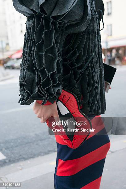 Head hunter and fashion blogger Thythu Nguyen wears a Xuan-Thu Nguyen jacket, Sonia Rykiel skirt, and Skinny Dip London bag on day 3 of Paris Haute...