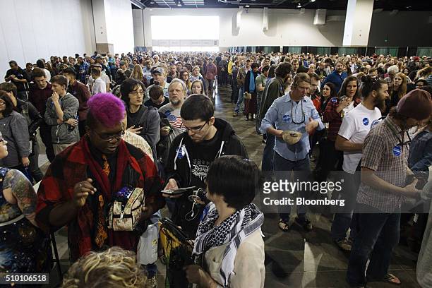 Attendees wait in line to enter a campaign event for Senator Bernie Sanders, an independent from Vermont and 2016 Democratic presidential candidate,...