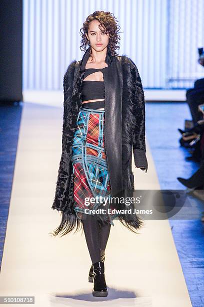 Model walks the runway during the Herve Leger by Max Azria fashion show at The Arc, Skylight at Moynihan Station on February 13, 2016 in New York...