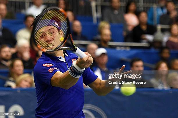 Kei Nishikori of Japan returns a shot to Sam Querrey of the United States during their semi-final singles match on Day 6 of the Memphis Open at the...