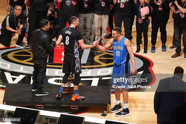 Zach LaVine of the Minnesota Timberwolves shakes hands with Aaron Gordon of the Orlando Magic after winning the Verizon Slam Dunk Contest during...