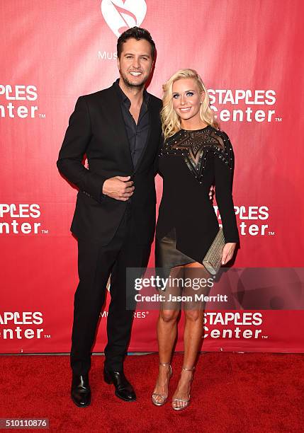 Singer Luke Bryan and Caroline Boyer Bryan attend the 2016 MusiCares Person of the Year honoring Lionel Richie at the Los Angeles Convention Center...