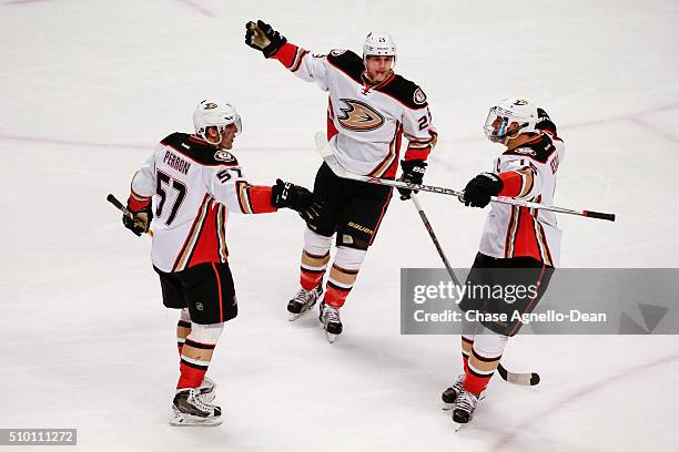 David Perron of the Anaheim Ducks celebrates with Mike Santorelli and Ryan Getzlaf after scoring against the Chicago Blackhawks in the third period...