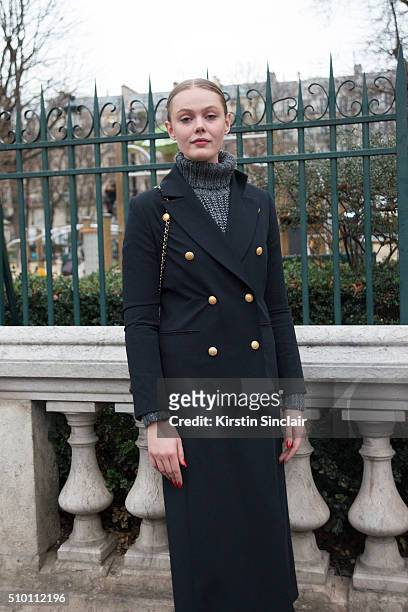 Model Frida Gustavsson wears a Hunky Dory coat, and a Chanel bag on day 4 of Paris Haute Couture Fashion Week Spring/Summer 2016, on January 27, 2015...