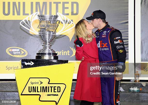 Denny Hamlin, driver of the FedEx Express Toyota, poses with his girlfriend Jordan Fish in Victory Lane after winning the NASCAR Sprint Cup Series...