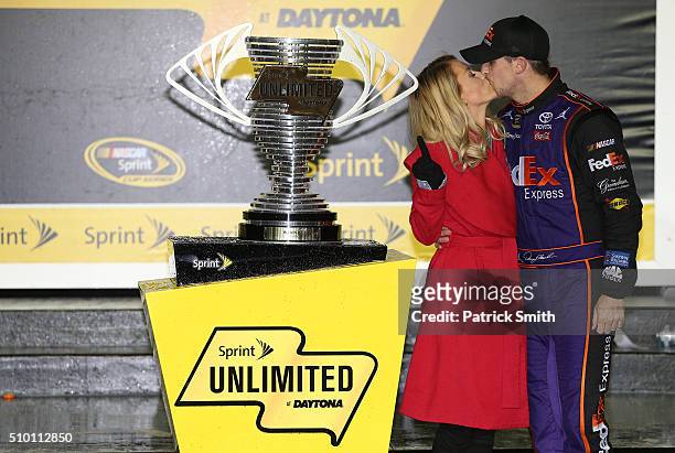 Denny Hamlin, driver of the FedEx Express Toyota, poses with his girlfriend Jordan Fish in Victory Lane after winning the NASCAR Sprint Cup Series...
