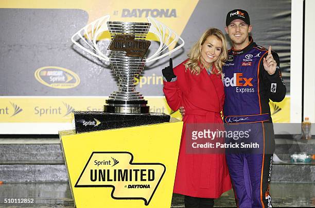 Denny Hamlin, driver of the FedEx Express Toyota, poses with his girlfriend Jordan Fish in Victory Lane after winning the NASCAR Sprint Cup Series...