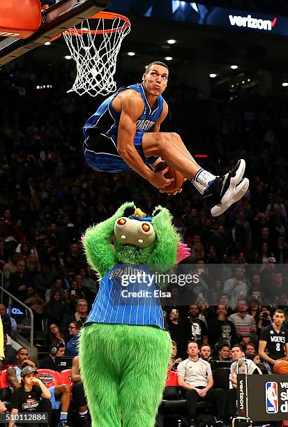 Aaron Gordon of the Orlando Magic dunks over Stuff the Orlando Magic mascot in the Verizon Slam Dunk Contest during NBA All-Star Weekend 2016 at Air...