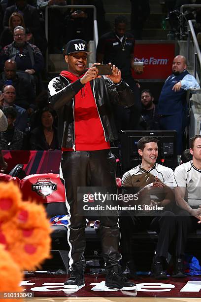 Carmelo Anthony of the New York Knicks takes a picture during the Verizon Slam Dunk Contest during State Farm All-Star Saturday Night as part of the...