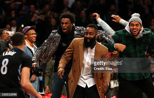 Andrew Wiggins of the Minnesota Timberwolves, James Harden of the Houston Rockets and Karl-Anthony Towns of the Minnesota Timberwolves react after a...