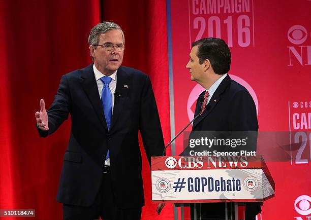 Republican presidential candidates Jeb Bush talks to Sen. Ted Cruz during a break of a CBS News GOP Debate February 13, 2016 at the Peace Center in...