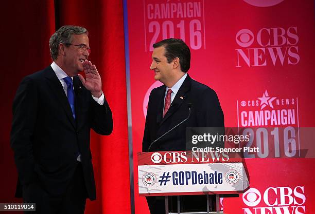 Republican presidential candidates Jeb Bush talks to Sen. Ted Cruz during a break of a CBS News GOP Debate February 13, 2016 at the Peace Center in...