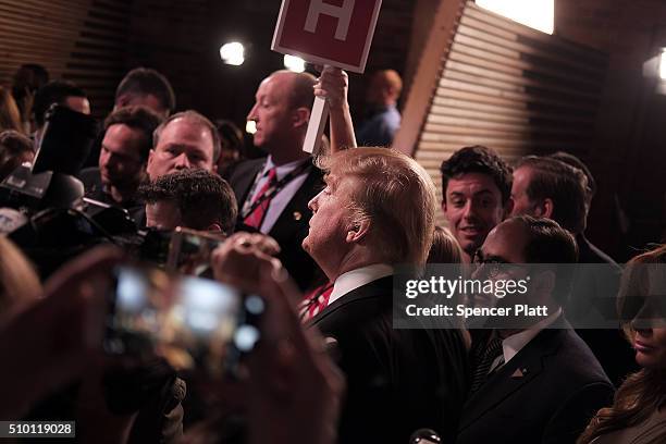 Presidential candidate Donald Trump speaks in the "Spin Room" following the Republican Presidential debate on February 13, 2016 in Greenville, South...