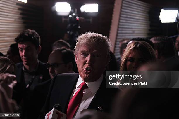 Presidential candidate Donald Trump speaks in the "Spin Room" following the Republican Presidential debate on February 13, 2016 in Greenville, South...