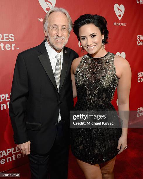 Recording Academy and MusiCares President/CEO Neil Portnow and recording artist Demi Lovato attend the 2016 MusiCares Person of the Year honoring...