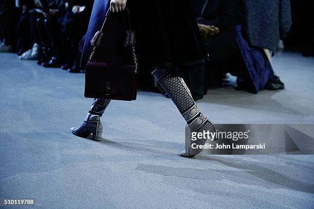 Models walk the runway, fashion, boot and bag detail, during the Altuzarra show during the Fall 2016 New York Fashion Week on February 13, 2016 in...