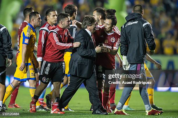 Miguel 'Piojo' Herrera, coach of Tijuana walks off the field at the end of the 6th round match between Tigres UANL and Tijuana as part of the...